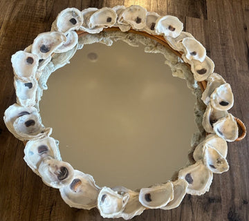 Round oyster adorned mirror